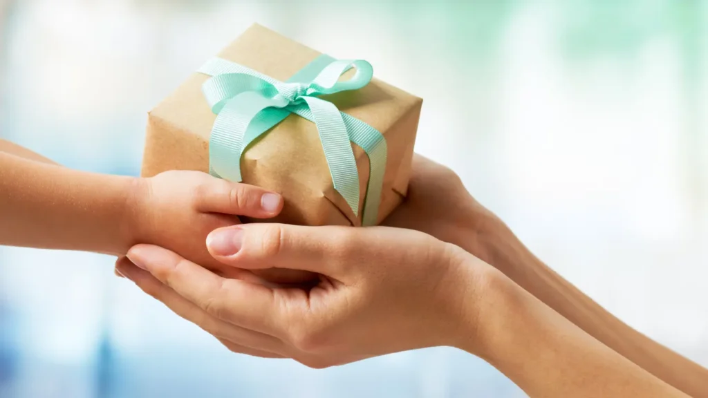 two people exchanging a gift